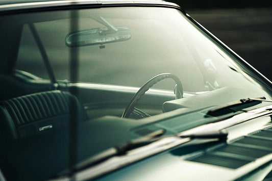 Vintage auto windshield as an example of where auto glass chip repair can excel.