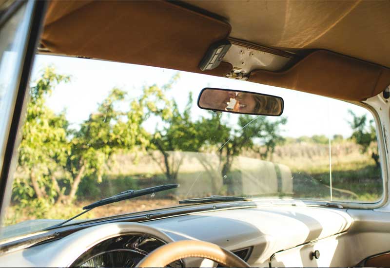 Image of a vintage car's windshield, free of chips after chip repairs.
